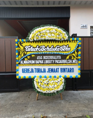Papan Bunga Duka di Tanon